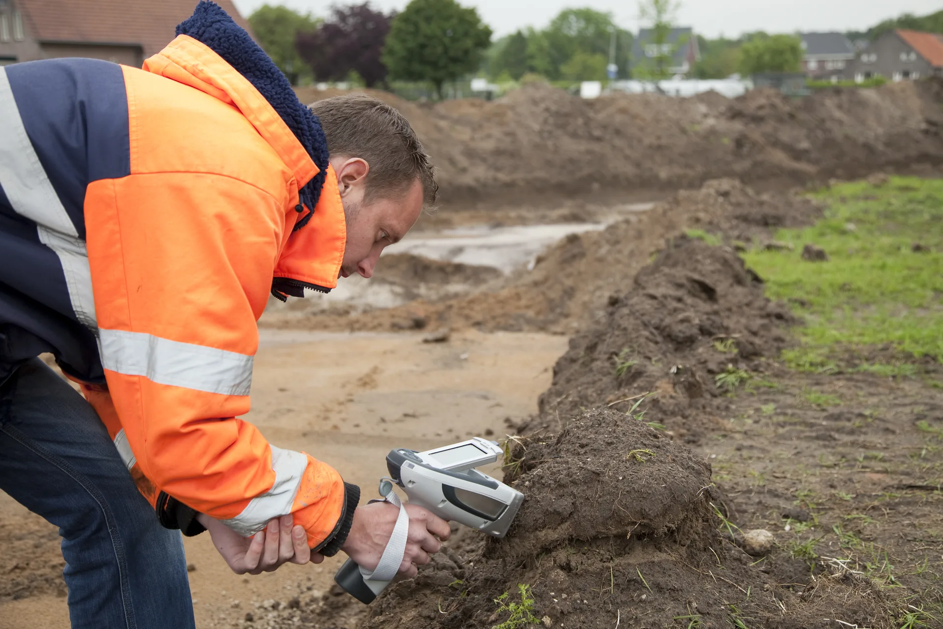 ESA consultant conducting soil scanning on a development site